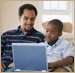 dad and son at computer