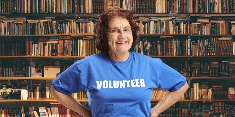 happy woman wearing volunteer shirt